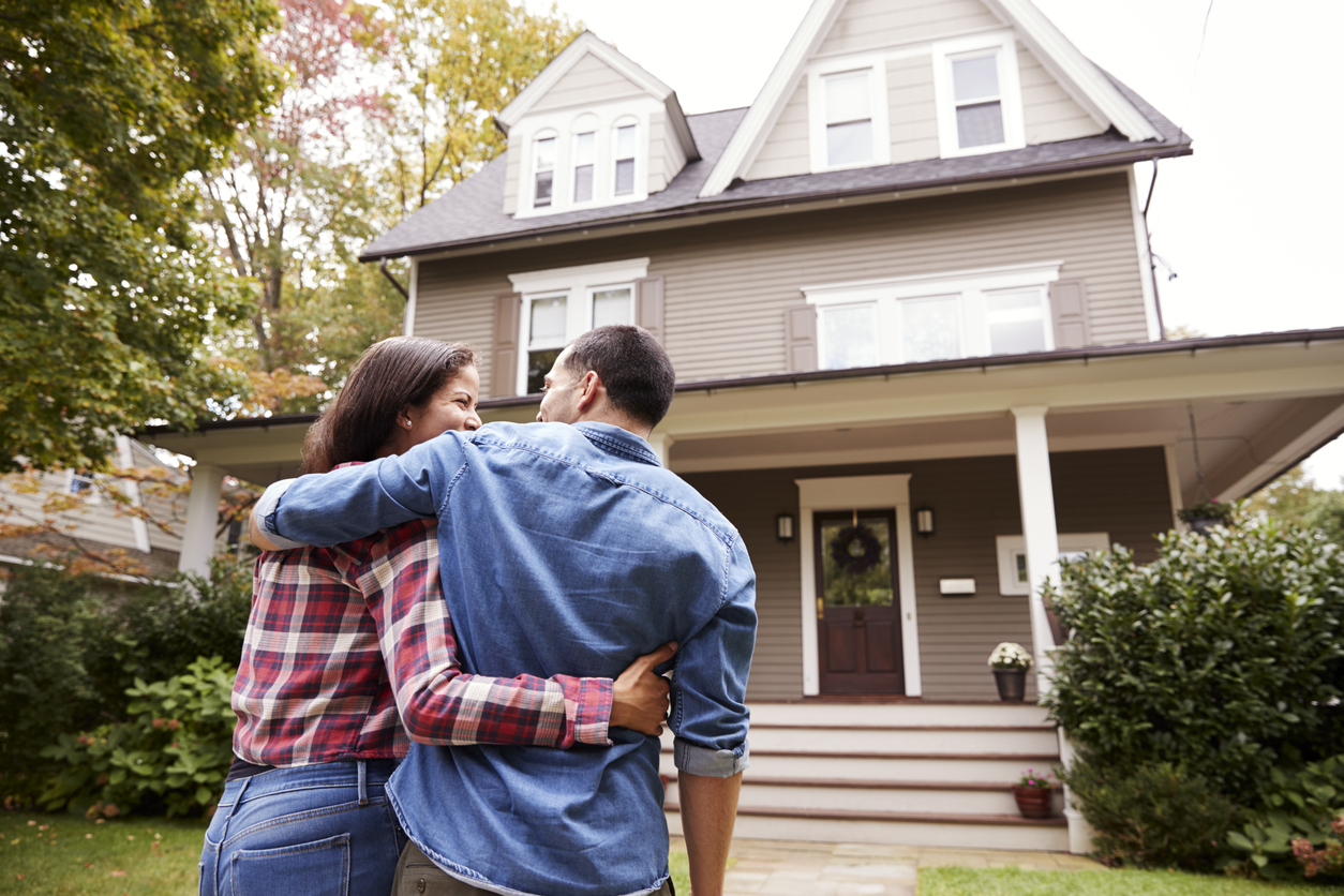 rear-view-of-loving-couple-walking-towards-house